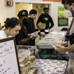 an attendee tries a sample