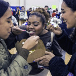 attendees enthusiastically taste vegan food